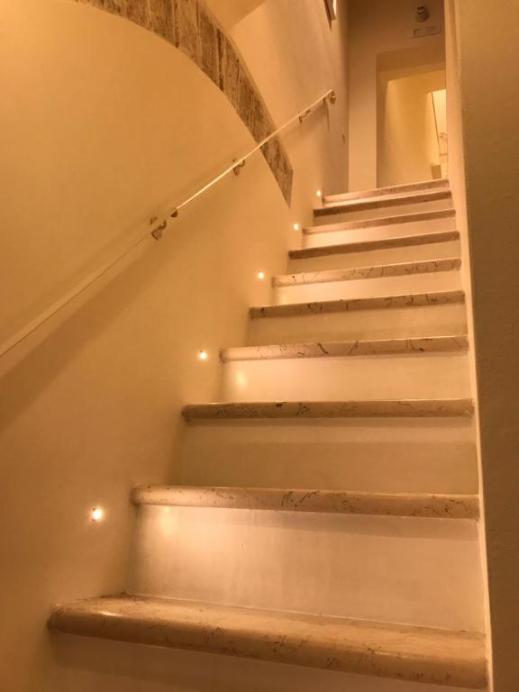 a stairway with lights on the stairs at Estlevante B&B in Vieste