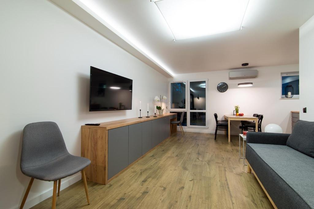 Televízia a/alebo spoločenská miestnosť v ubytovaní Apartamenty Rynek3 , Kazimierz Dolny