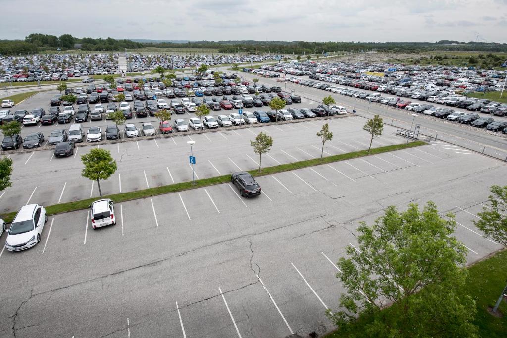 an aerial view of a parking lot with cars at Aalborg Airport Hotel in Aalborg