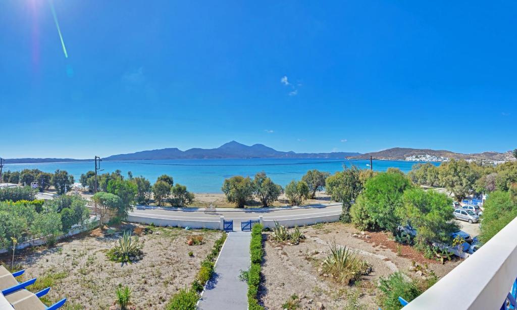 a view of the lake from the balcony of a house at Nikos Sea View Apartments in Adamas