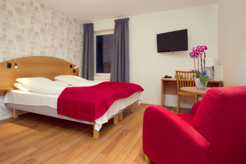 En eller flere senger på et rom på Comfort Hotel Fosna