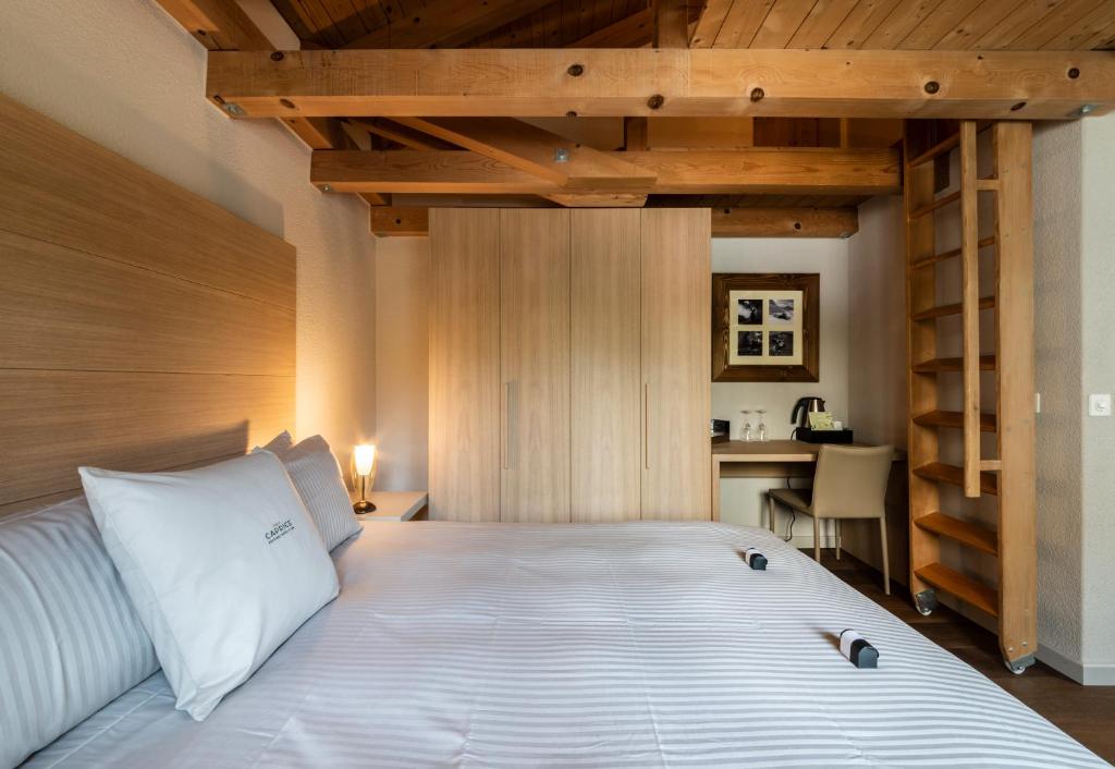 Postel nebo postele na pokoji v ubytování Hotel Maya Caprice