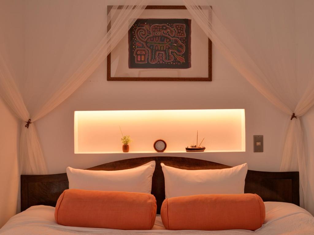 Postel nebo postele na pokoji v ubytování Sound Swell Resort