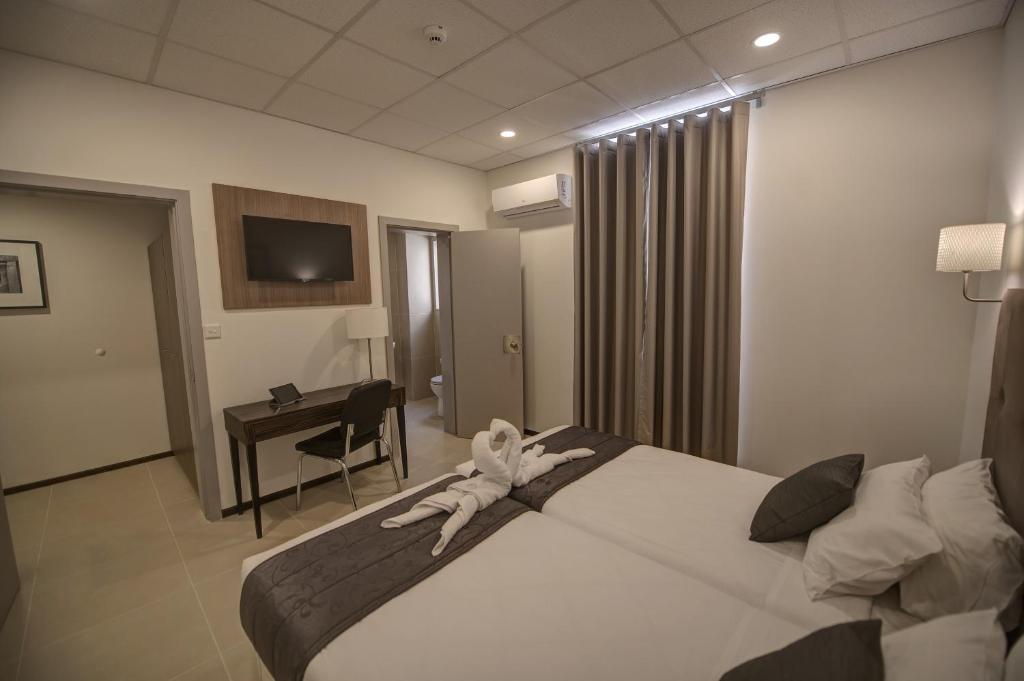 Postel nebo postele na pokoji v ubytování Europa Hotel