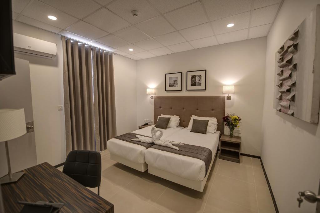 Postel nebo postele na pokoji v ubytování Europa Hotel