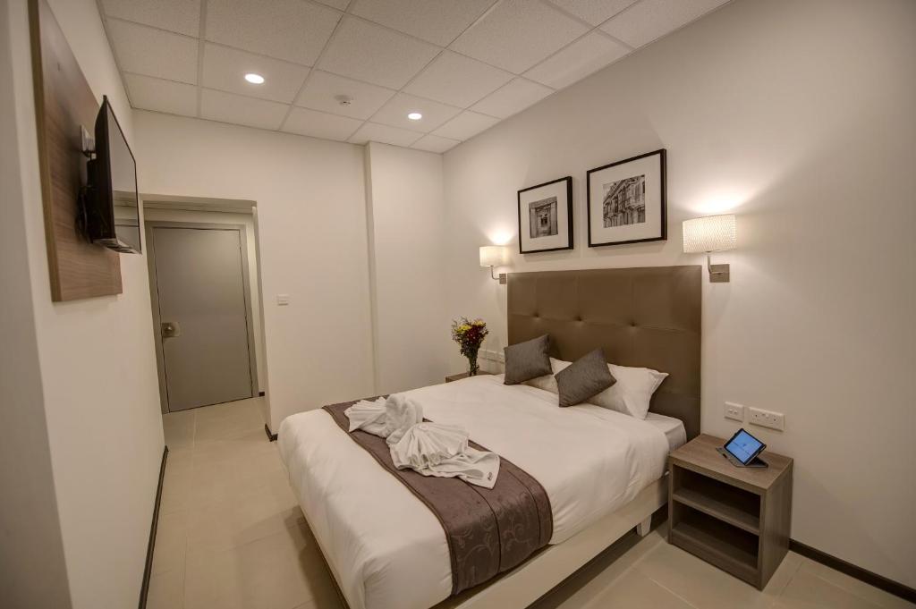 Postel nebo postele na pokoji v ubytování Europa Hotel