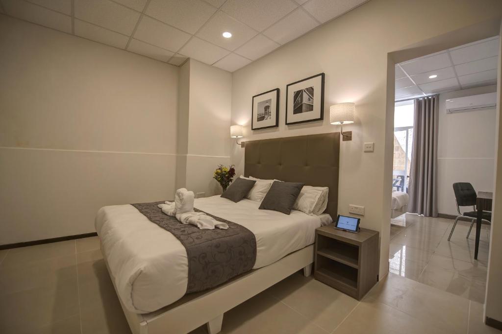 Postel nebo postele na pokoji v ubytování Europa Hotel