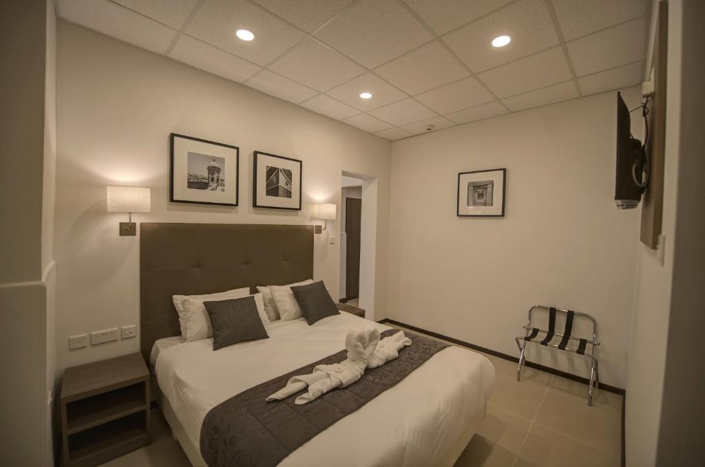 Postel nebo postele na pokoji v ubytování Europa Hotel