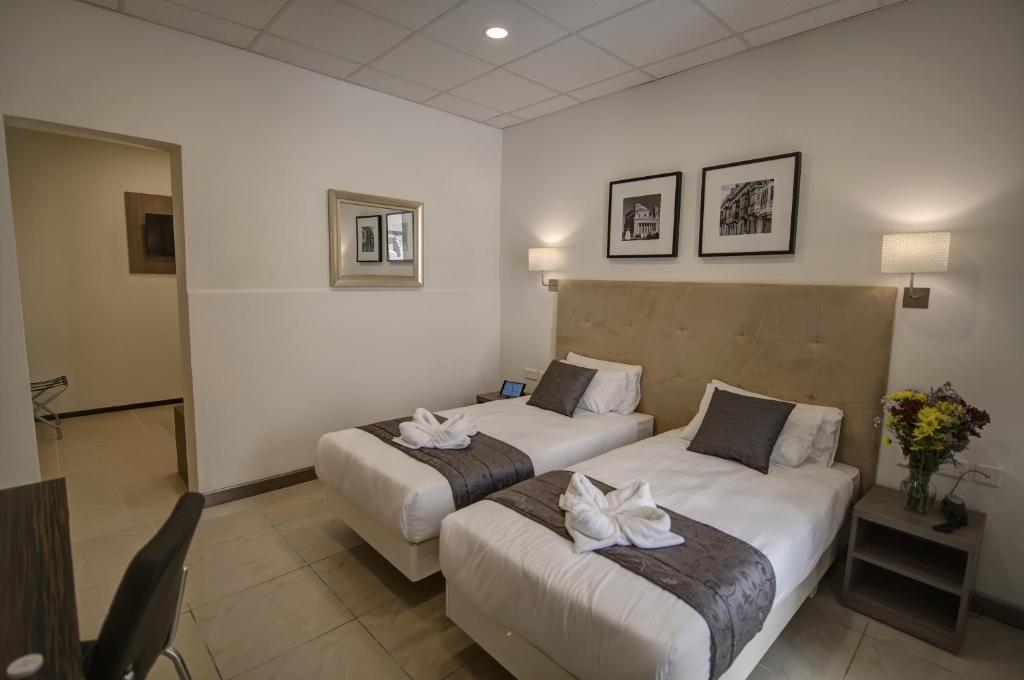 Postel nebo postele na pokoji v ubytování Europa Hotel
