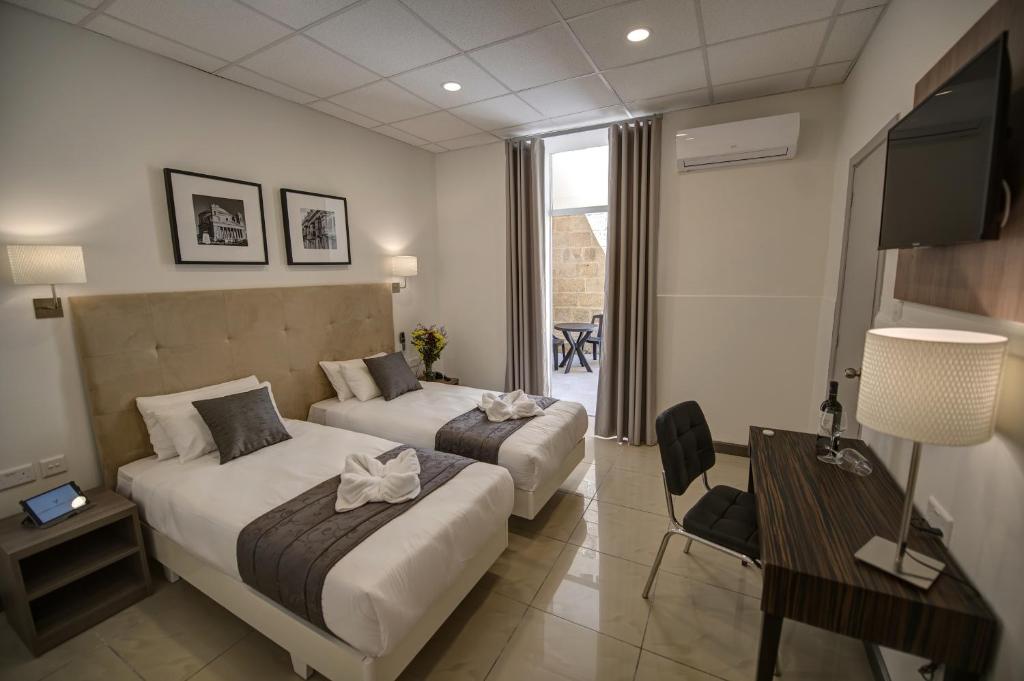Postel nebo postele na pokoji v ubytování Europa Hotel