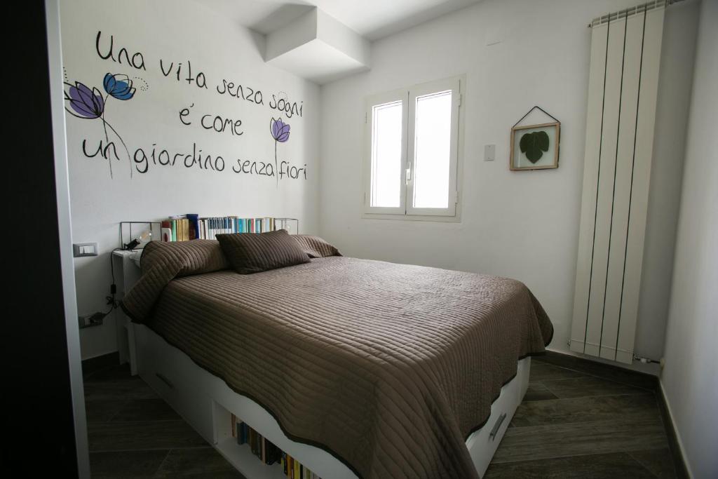 Łóżko lub łóżka w pokoju w obiekcie Agriturismo Oltrealmare
