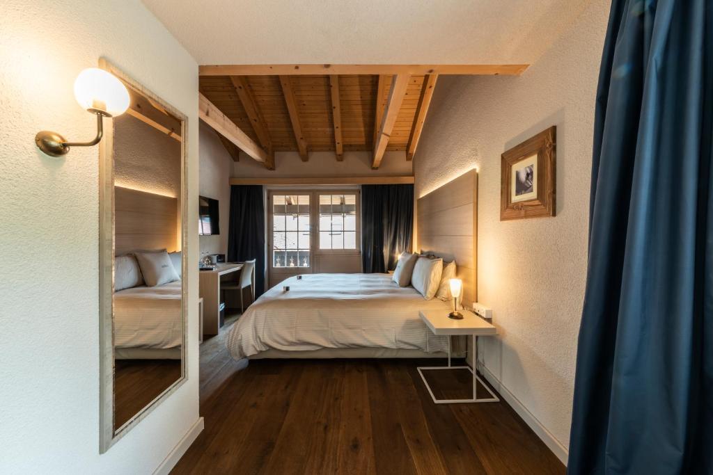 Postel nebo postele na pokoji v ubytování Hotel Maya Caprice