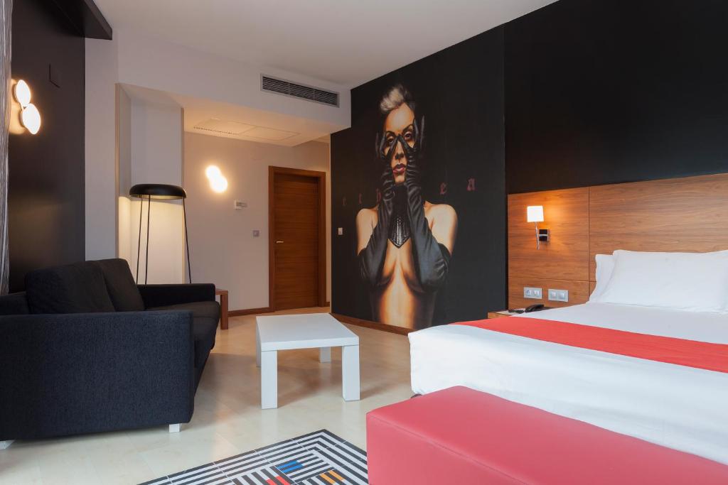 Postel nebo postele na pokoji v ubytování Spirit Hotel Gran Bilbao
