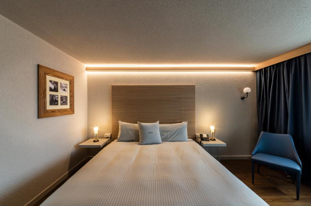 Postel nebo postele na pokoji v ubytování Hotel Maya Caprice