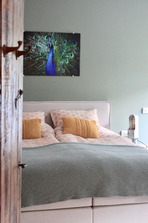 Postel nebo postele na pokoji v ubytování B&B de Sfeerhoeve