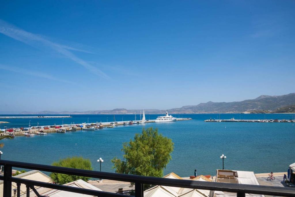 a view of a harbor with boats in the water at Sitia Old Port Apartment in Sitia