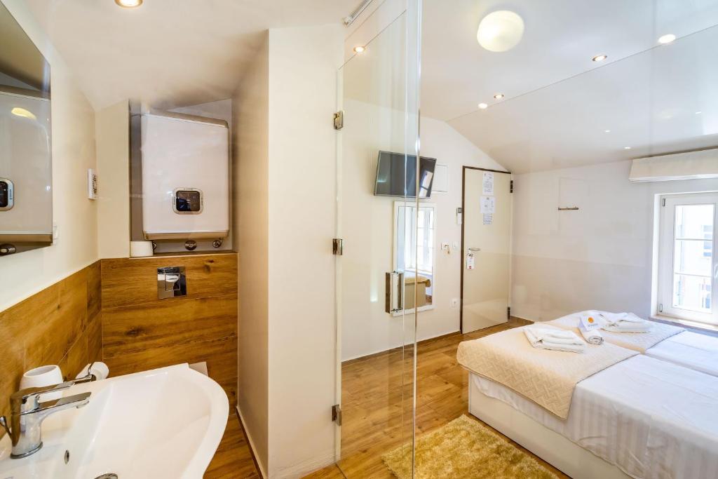 Postel nebo postele na pokoji v ubytování Idassa Palace rooms