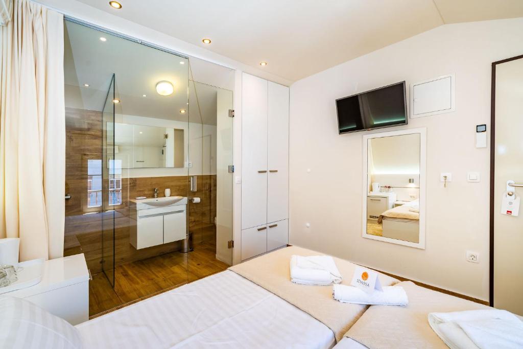 Postel nebo postele na pokoji v ubytování Idassa Palace rooms