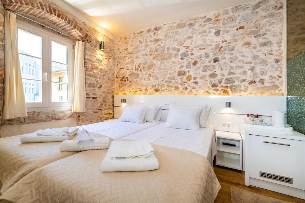 Postel nebo postele na pokoji v ubytování Idassa Palace rooms