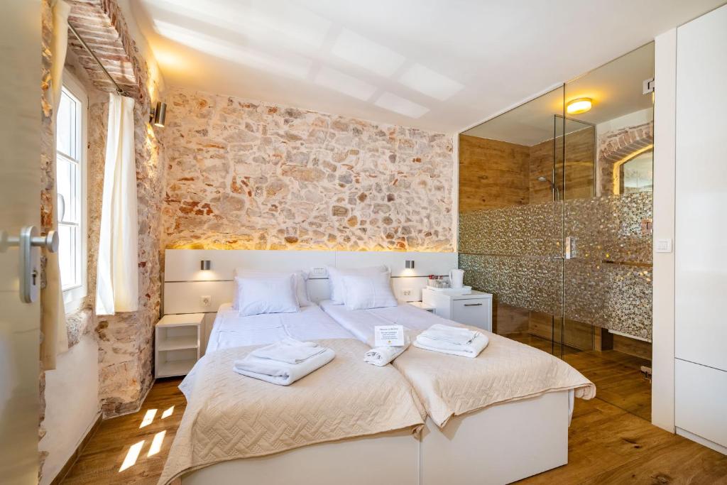 Postel nebo postele na pokoji v ubytování Idassa Palace rooms