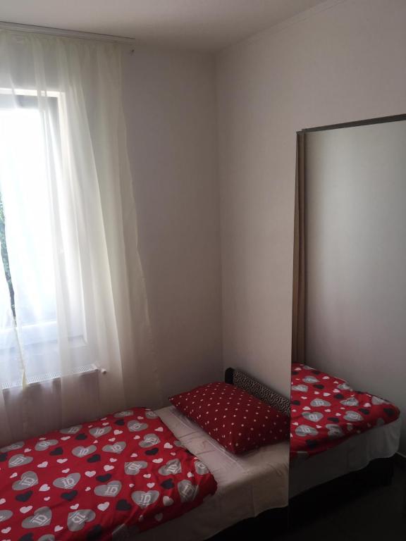 Postel nebo postele na pokoji v ubytování Tocc Apartman