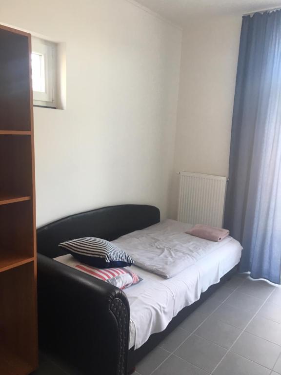 Postel nebo postele na pokoji v ubytování Tocc Apartman