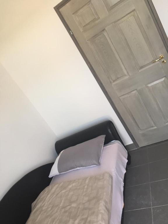 Postel nebo postele na pokoji v ubytování Tocc Apartman