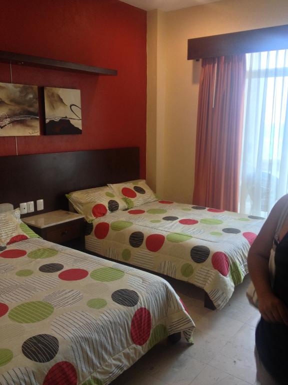 Postel nebo postele na pokoji v ubytování Hotel Bogavante
