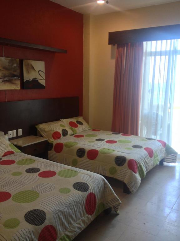 Postel nebo postele na pokoji v ubytování Hotel Bogavante