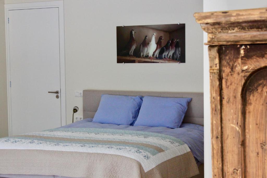 Postel nebo postele na pokoji v ubytování B&B de Sfeerhoeve