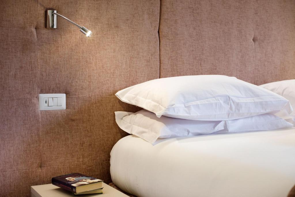 Postel nebo postele na pokoji v ubytování Le Muse Suite