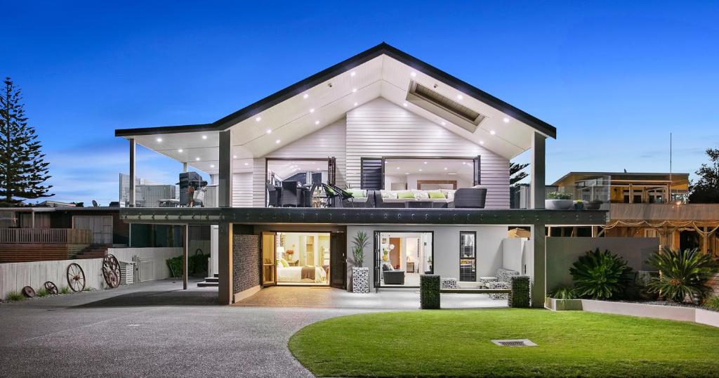 a house with a view of the front of it at Waihi Beach Paradise Resort in Waihi Beach