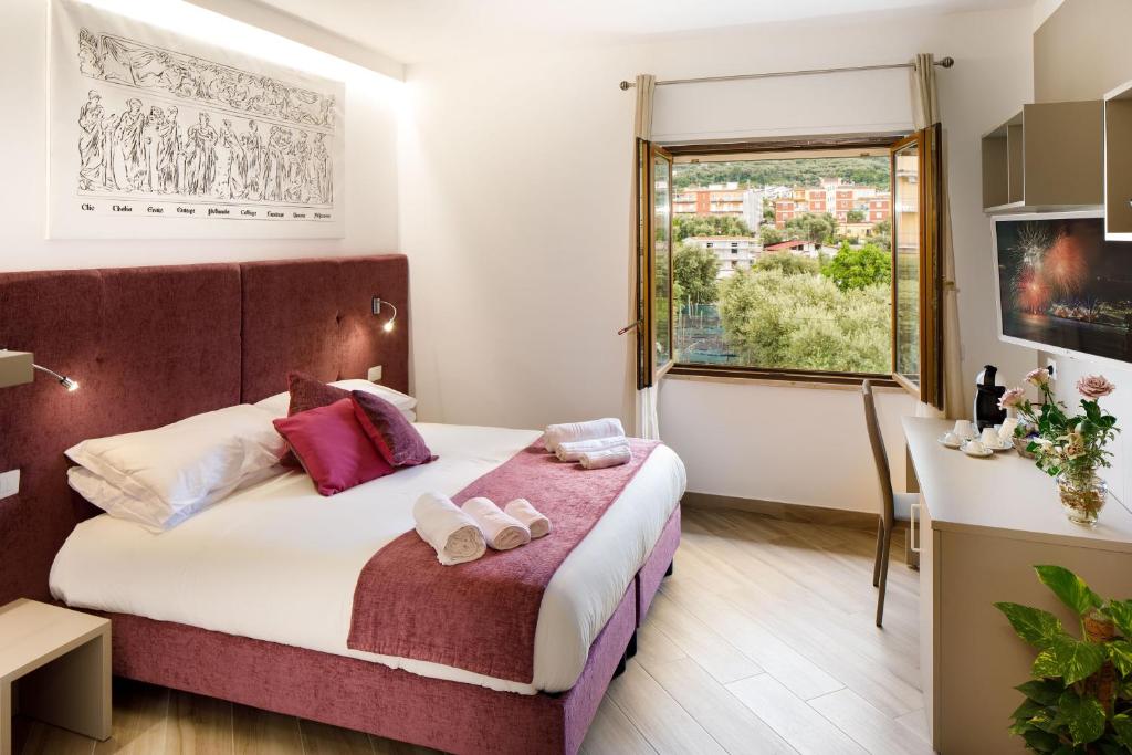 Postel nebo postele na pokoji v ubytování Le Muse Suite