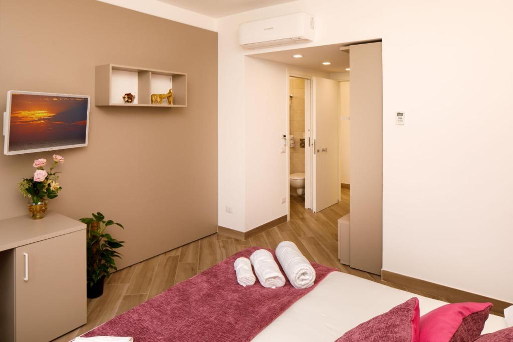 Postel nebo postele na pokoji v ubytování Le Muse Suite