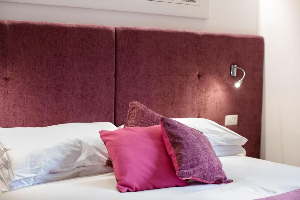 Postel nebo postele na pokoji v ubytování Le Muse Suite
