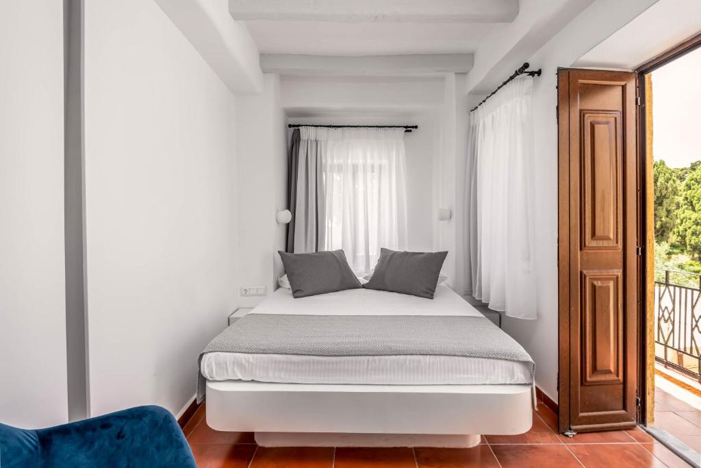 Postel nebo postele na pokoji v ubytování Casa De La Sera