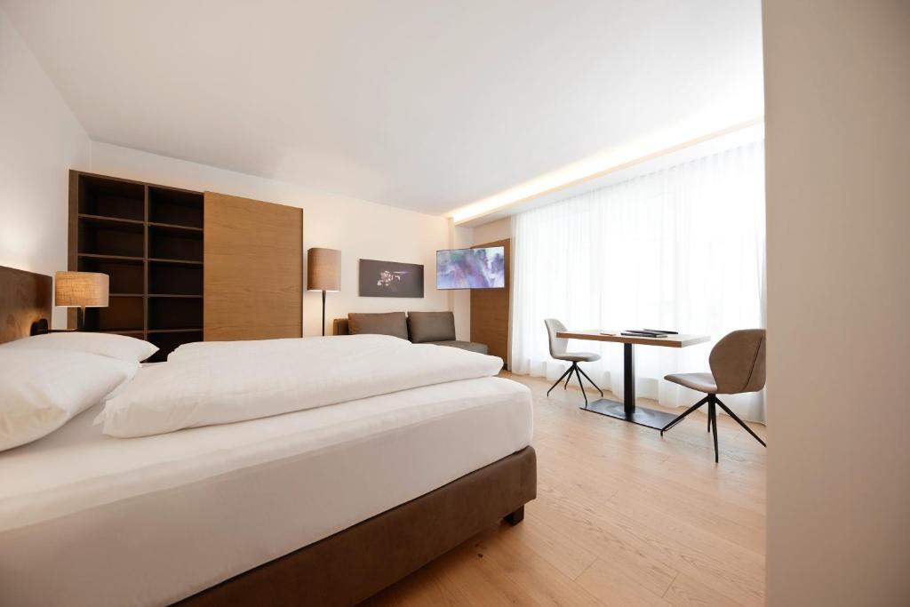 Postel nebo postele na pokoji v ubytování Hotel Gösser Bräu