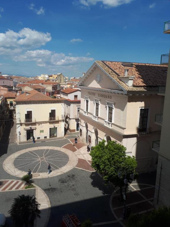 a view of a building with a courtyard in a city at Business Home Piazza Cesare Battisti B&B Residence in Foggia