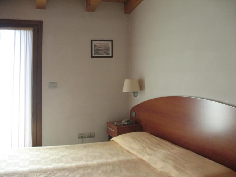 Postel nebo postele na pokoji v ubytování Hotel Vittoria