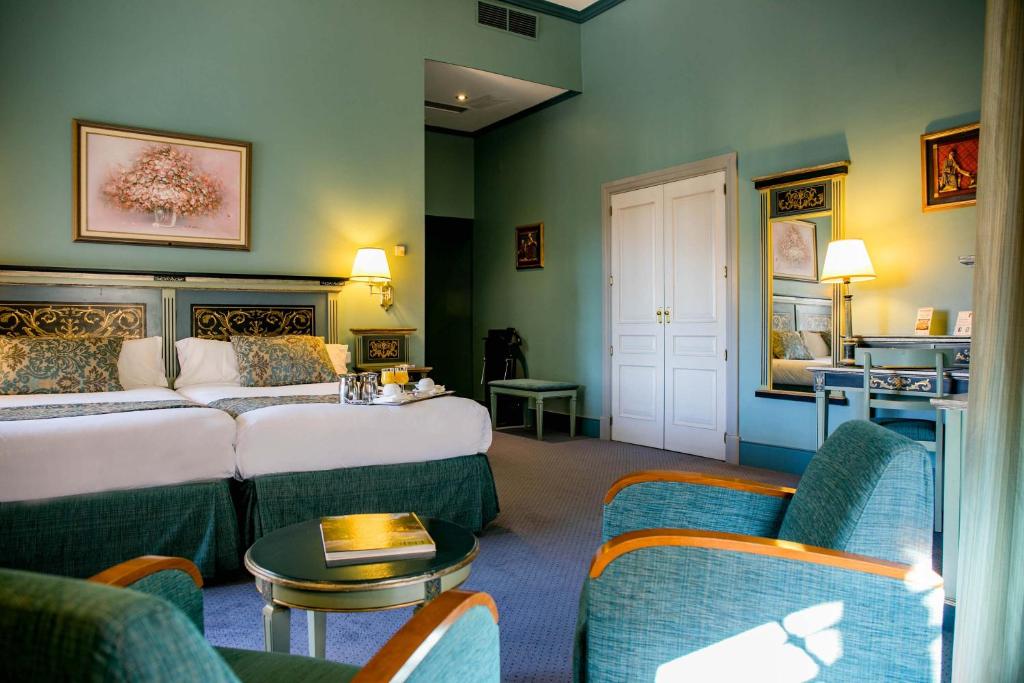 Postel nebo postele na pokoji v ubytování Palacio de los Velada