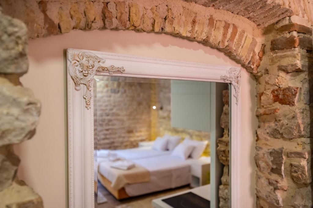 Postel nebo postele na pokoji v ubytování Idassa Atrium rooms