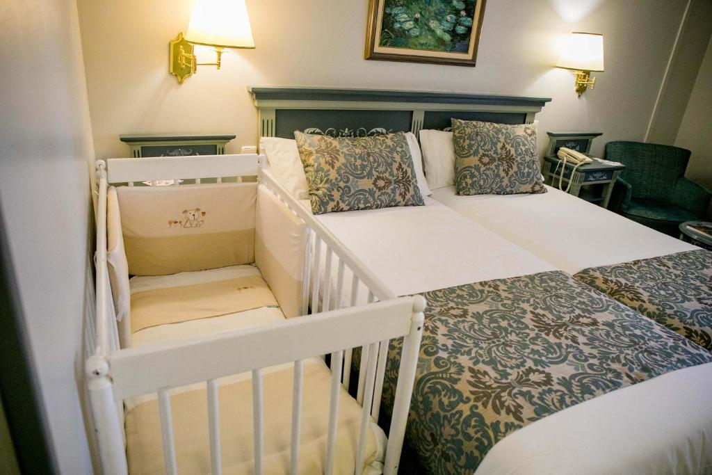 Postel nebo postele na pokoji v ubytování Palacio de los Velada