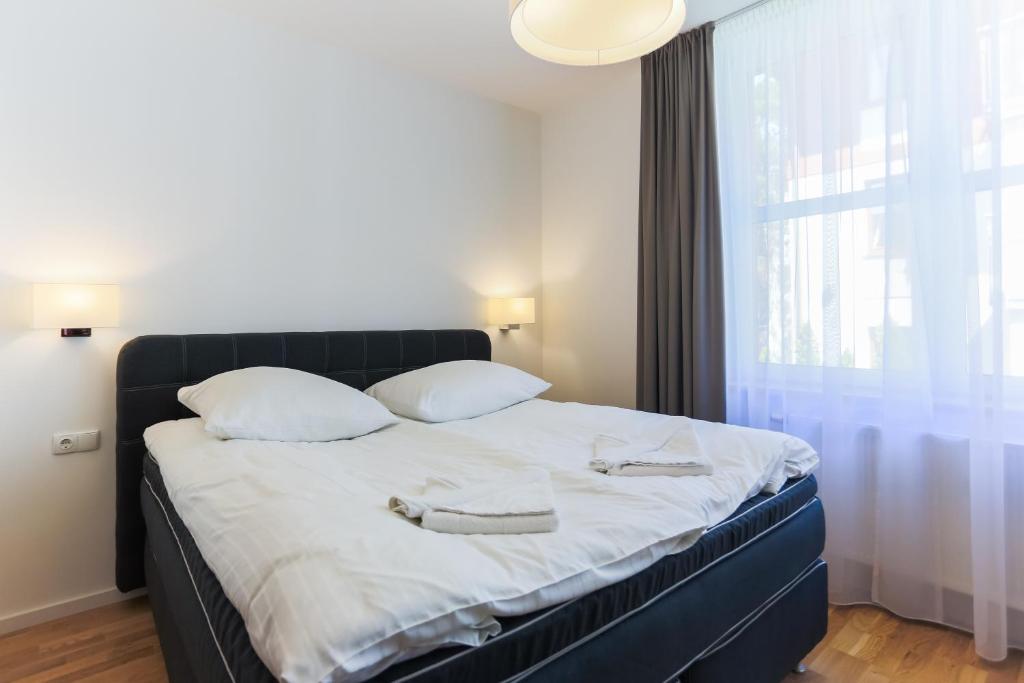 Posteľ alebo postele v izbe v ubytovaní Apartamenty Świnoujście - Rubin II