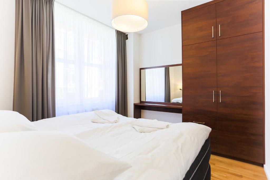Posteľ alebo postele v izbe v ubytovaní Apartamenty Świnoujście - Rubin II