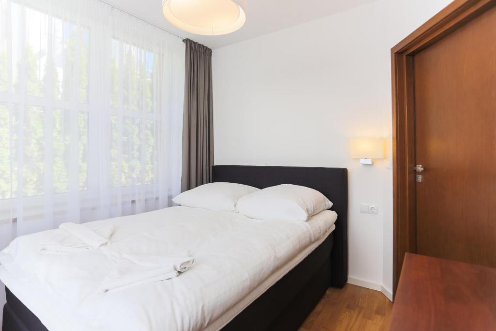 Posteľ alebo postele v izbe v ubytovaní Apartamenty Świnoujście - Rubin II