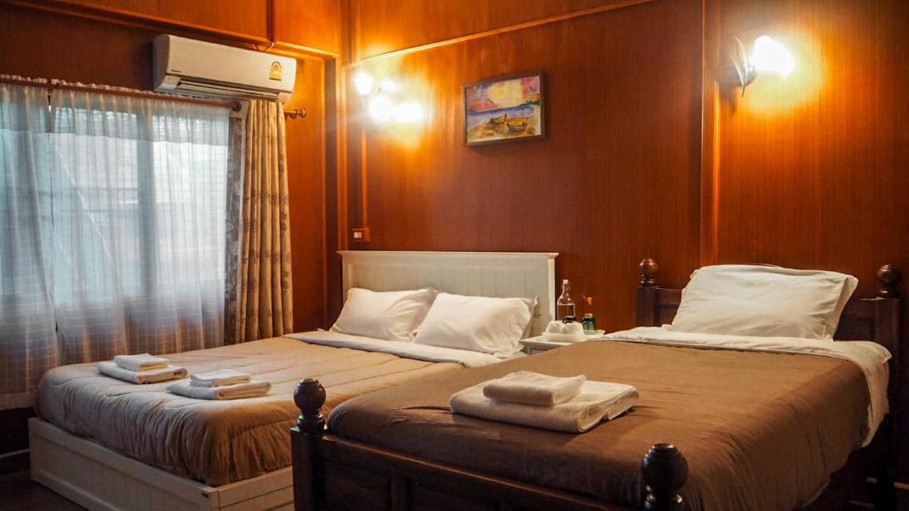 Ein Bett oder Betten in einem Zimmer der Unterkunft Kantawan House