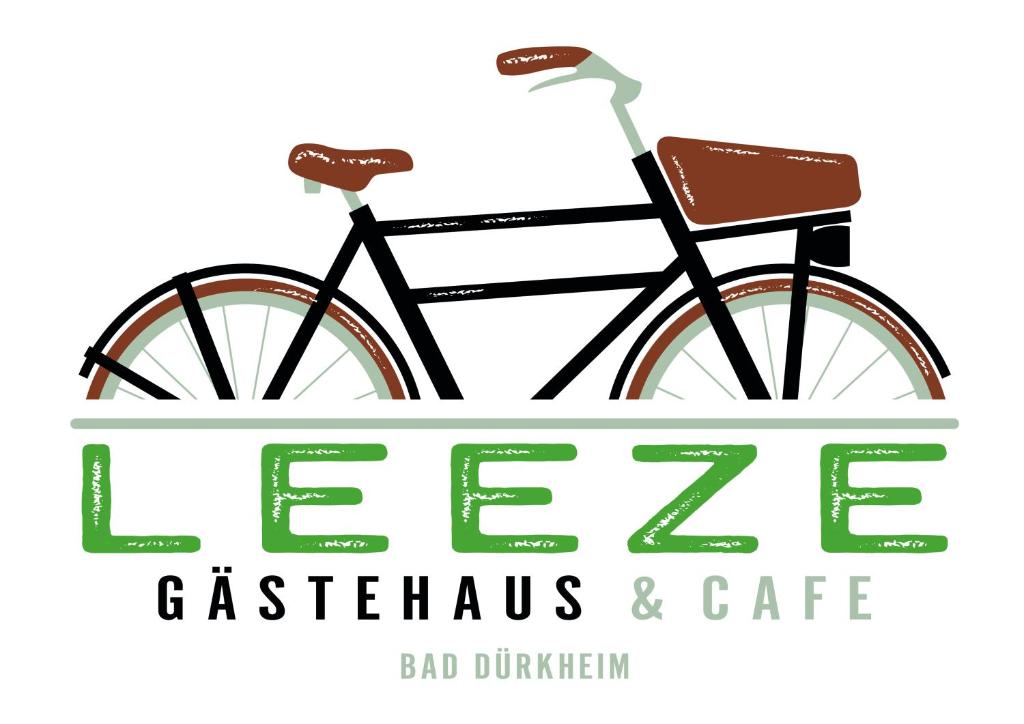 Una bicicleta estacionada junto a un letrero para un café en Gästehaus & Café Leeze, en Bad Dürkheim