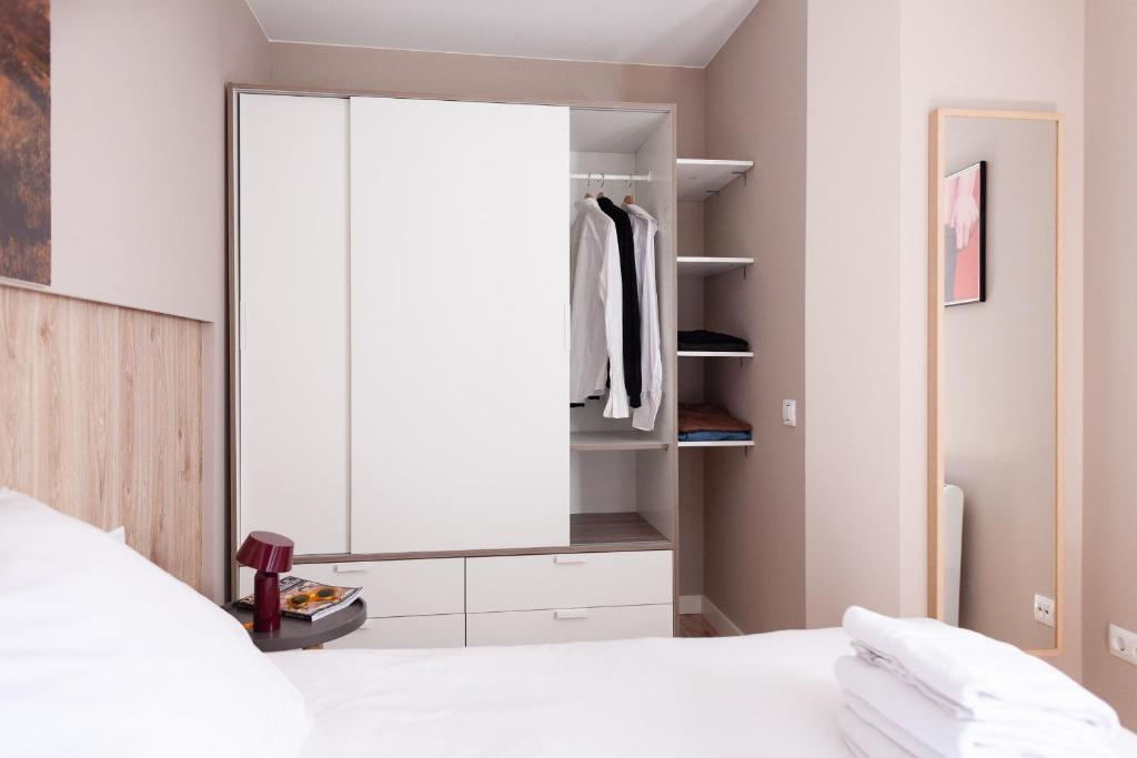 Posteľ alebo postele v izbe v ubytovaní Brummell Apartments Poble Sec