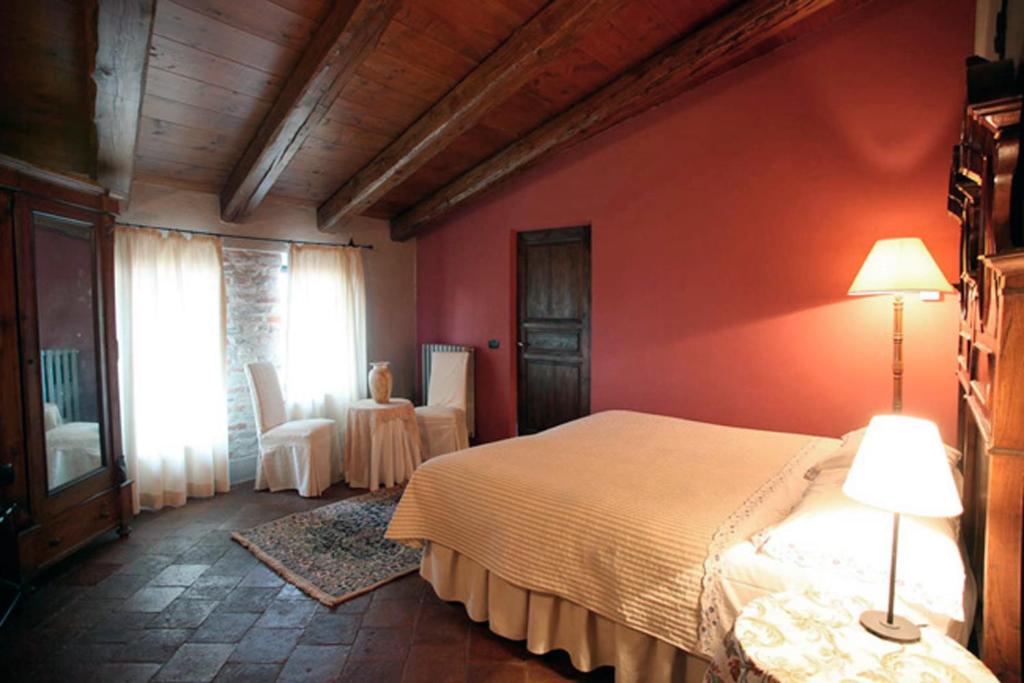 Ένα ή περισσότερα κρεβάτια σε δωμάτιο στο Dindina Agriturismo