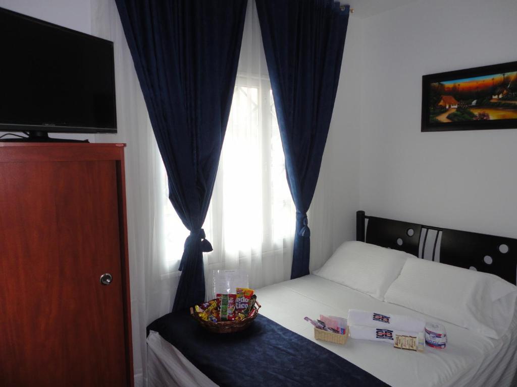 Postel nebo postele na pokoji v ubytování Hotel Casa Sabelle